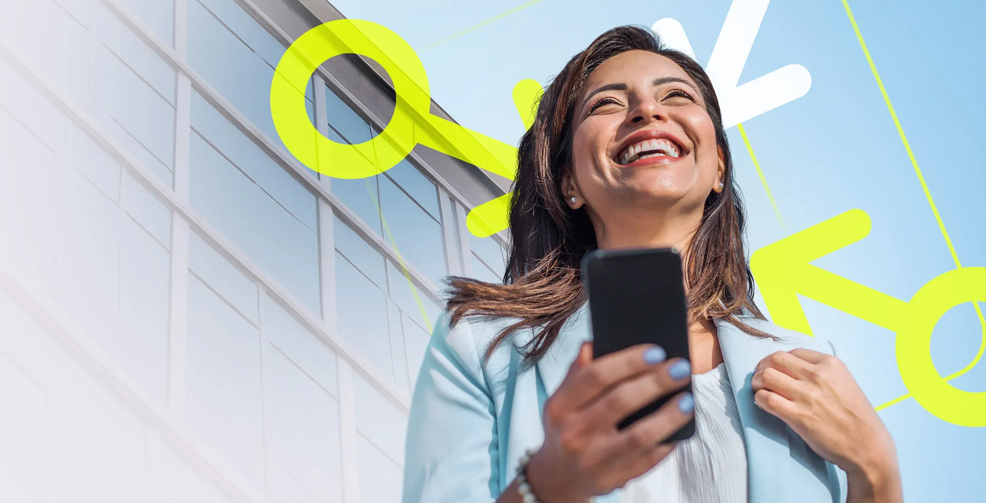 woman stood outside a modern office holding a phone in her hand and looking upwards with a smile on her face, happy with the opportunities she has discovered for legal professionals on TalentNext.